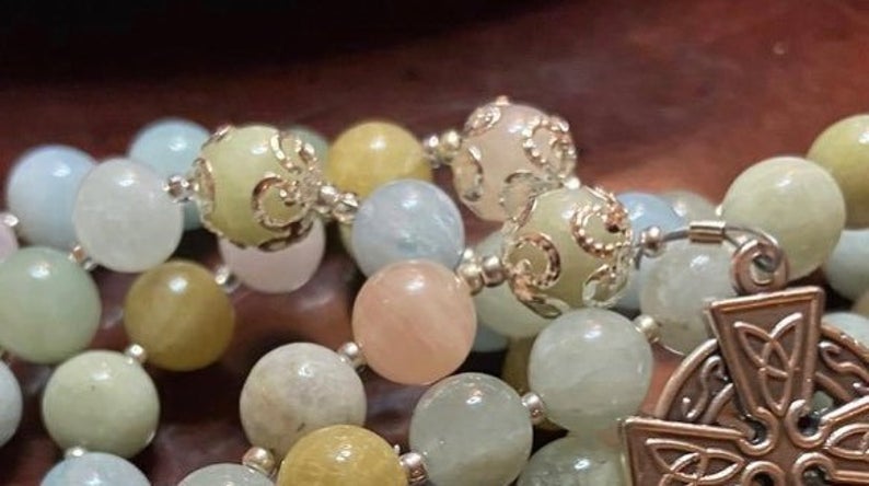 This handcrafted Colorful Morganite rosary has been made with care and detail, producing a traditional Catholic 5 decade format