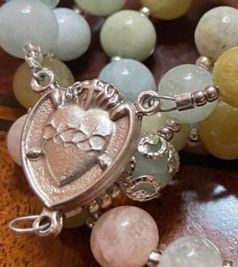This handcrafted Colorful Morganite rosary has been made with care and detail, producing a traditional Catholic 5 decade format